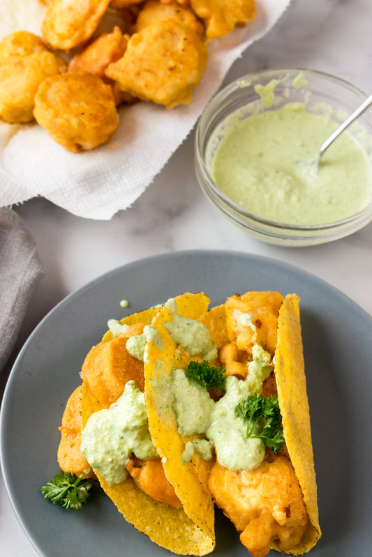 Crispy fish tacos with jalapeño sauce