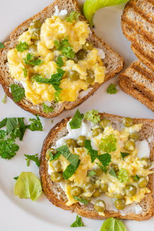 Simple Goat Cheese and Egg Toasts with Fresh Peas and Herbs